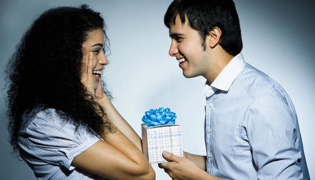 Young Man Giving Young Woman a Present