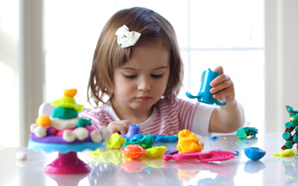 Girl playing with play dough