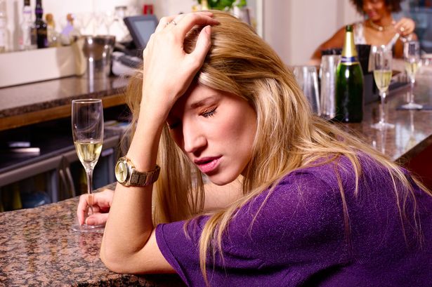 Depressed female drunk in Bar